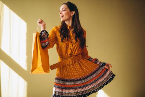 young-woman-with-shopping-bags-beautiful-dress
